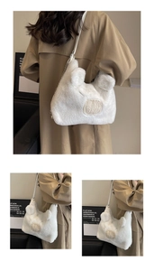 Detail of white plush shoulder bag with animal ears and metal chain on a model