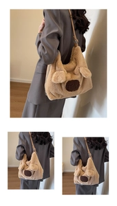 Detail showing the adjustable leather shoulder strap and soft camel plush texture of the bag