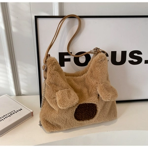 Detail of plush bear-shaped shoulder bag showing soft faux fur and adjustable strap