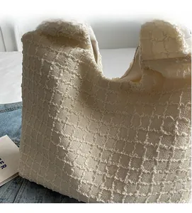 Close-up of beige tote bag showing high-quality textured bubble fabric and soft material