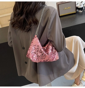 Detail of pink sequin tote bag with metallic sheen and silver chain strap