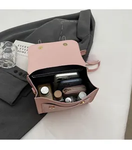 Pink leather crossbody bag interior showing spacious storage for phone and wallet