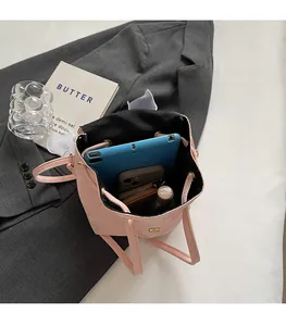 Spacious interior of pink drawstring backpack showing capacity for tablet and phone