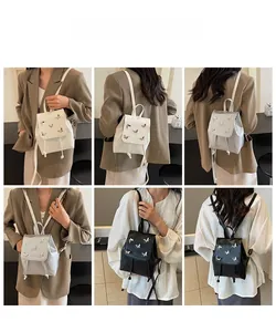 Detailed views of mini butterfly backpacks in white, silver and black displayed on model