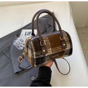 Detail of plush checkerboard Boston bag with faux fur texture and adjustable strap