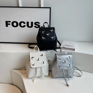Mini PU leather backpack for women with metal butterfly decor in black white and silver