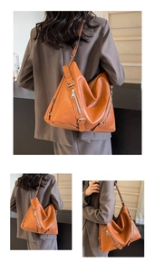 Detail of caramel soft PU hobo bag with silver zippers and buckle on shoulder