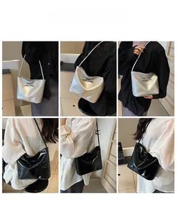 Detail view of stylish tote bags with bow decoration in silver and black finishes