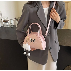Pink patent leather saddle handbag with butterfly applique and fluffy cloud charm for women