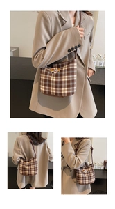 Detailed view of vintage brown plaid hobo bag with cute dog embroidery and knotted strap