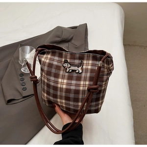 Detail of vintage brown plaid canvas tote with embroidered dachshund and knotted strap