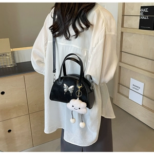 Chic black vintage bowling bag with silver butterfly and white cloud plush pendant