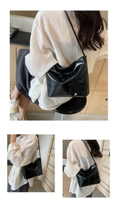 Détail d'un sac à bandoulière noir brillant avec un nœud élégant et une texture en cuir chic