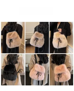 Detail view of plush faux fur backpack showing drawstring closure and black strap texture