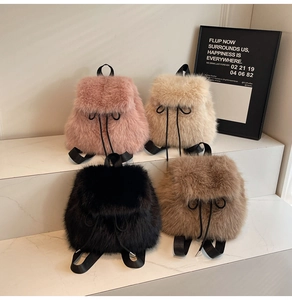 Detailed view of four fluffy faux fur mini backpacks in pink, beige, black, and brown