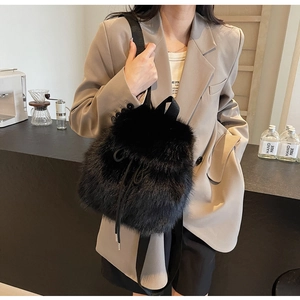 Chic black faux fur drawstring backpack for women featuring a fluffy plush texture