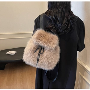 Chic light brown faux fur backpack for women featuring a drawstring closure and leather straps