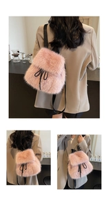 Detail of pink faux fur backpack featuring soft plush texture and black drawstring closure