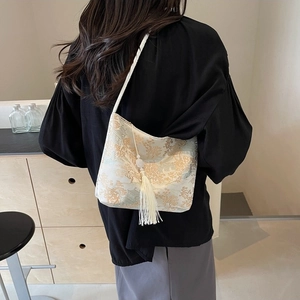 New Chinese style jacquard hobo bag with floral patterns and a long white tassel charm