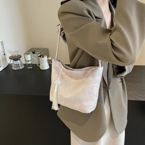 Elegant light pink jacquard shoulder bag with traditional Chinese floral patterns and tassel
