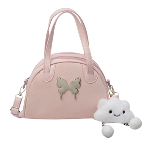 Pink semi-circle crossbody bag with silver butterfly and plush cloud keychain