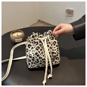 Fashionable leopard print drawstring bucket bag with adjustable crossbody strap for women