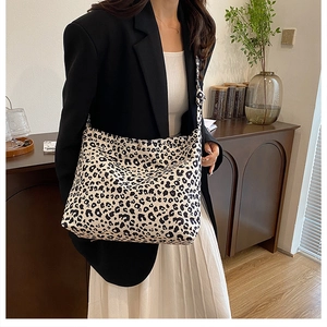 Fashionable leopard print tote bag styled in a cozy home setting for lifestyle display