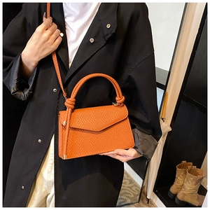 Chic orange-brown woven textured crossbody bag with knot handle for autumn and winter