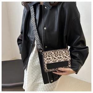 Chic leopard print crossbody bag with textured wide strap and leather patchwork