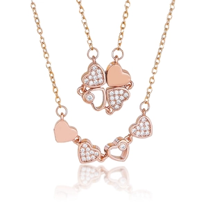 Rose gold necklace with folding heart pendants that transform into a four-leaf clover