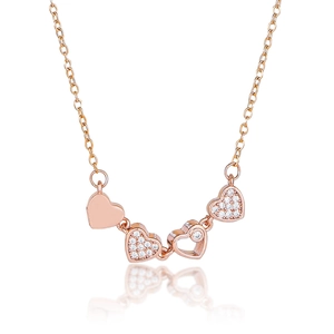 Detailed view of rose gold four-heart pendant necklace with white zircon pavé setting