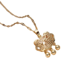 Minimalist gold necklace with traditional luck lock pendant and three spherical charms