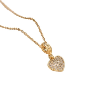 Elegant gold-tone heart pendant necklace with shimmering crystal pavé on thin chain
