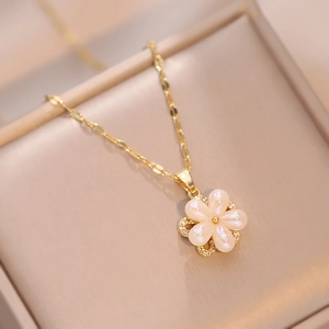 Titanium steel floral necklace with iridescent pearl petals and gold chain