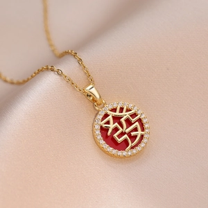 Gold necklace with red enamel pendant featuring a Chinese character and zircon accents