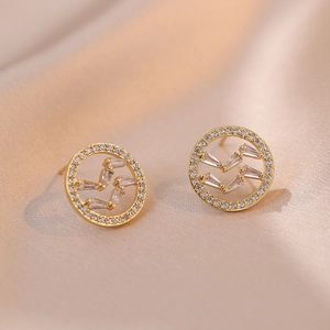 Golden round stud earrings with baguette-cut zircon geometric design on champagne silk