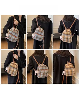 Detailed views of small plaid canvas backpack with plush charm in various carry angles