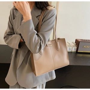 Large beige leather tote bag with FASHION label, ideal for office commuting