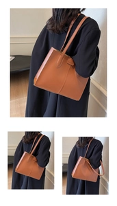 Close-up of caramel leather tote bag with fine stitching and chic fashion brand tag