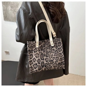 Large capacity leopard print tote bag with cream straps and adjustable crossbody strap