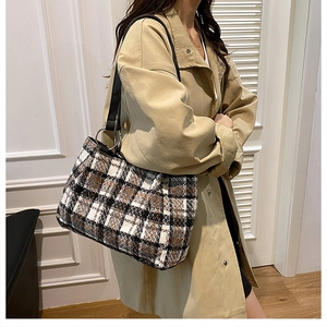 Stylish black and white plaid tweed tote bag with metal rings for autumn outfits