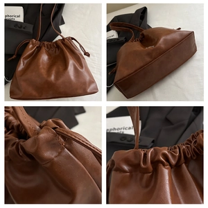 Detailed view of the brown soft leather bucket bag, featuring a drawstring closure design.