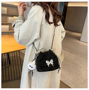 Chic black drawstring bucket bag with sequin butterfly and cute monster plush pendant