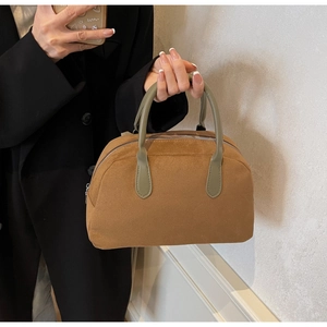 Retro faux suede Boston bowling bag in caramel brown with green handles for women