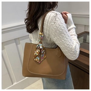 Brown leather tote bag with silk scarf and white contrast stitching for casual wear