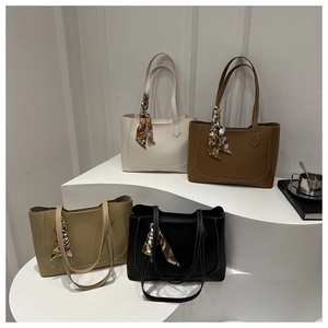 Fashionable tote bag set in four colors featuring elegant silk scarf handle accents