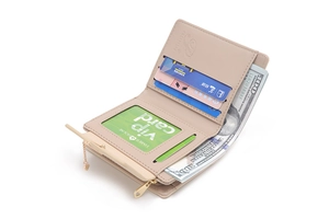 Detail view of beige foldover wallet showing multiple card slots and cash compartment