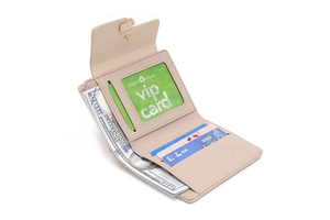 Detailed interior of a beige tri-fold wallet with multiple card slots and an ID window