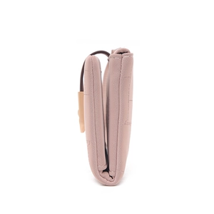 Side view of folded pink leather wallet showing multi-layer compartments and stitching