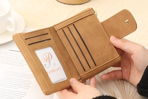 Brown bifold wallet interior showing multiple card slots and transparent ID window